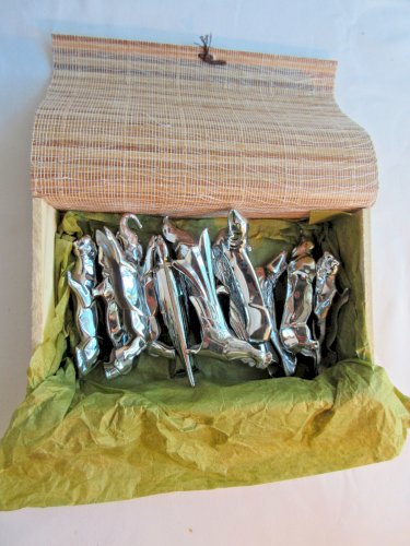 12 porte-couteaux Art Déco métal argenté: coq, faisan, lionne, otarie, etc...