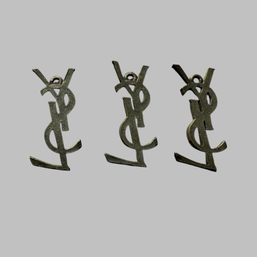 3 Pendentifs Pampilles vintage Yves Saint-Laurent monogramme accessoire de mode
