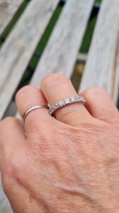 White gold American alliance with stones, white sapphire.