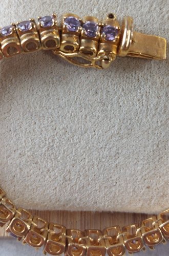 Ancien bracelet décor strass mauve, en métal doré