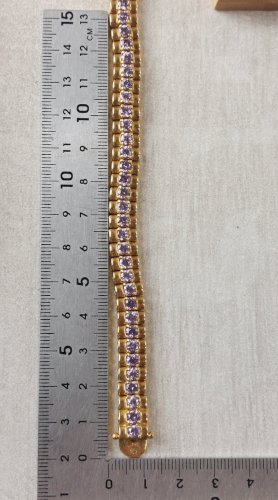 Ancien bracelet décor strass mauve, en métal doré