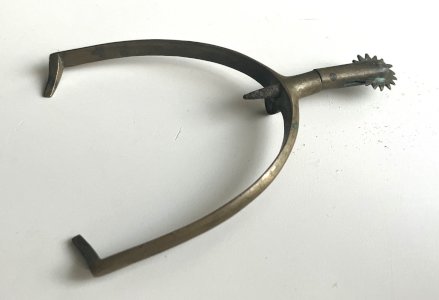 old brass roller spur, military?