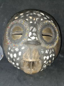 ancient African wooden mask with brass plate in good condition