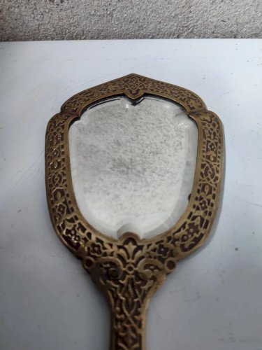 ancien miroir en bronze ou laiton avec verre biseautée en bon etat