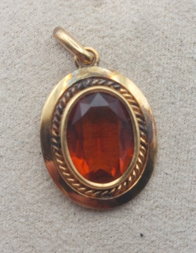 Ancien pendentif, pierre orange, en métal doré