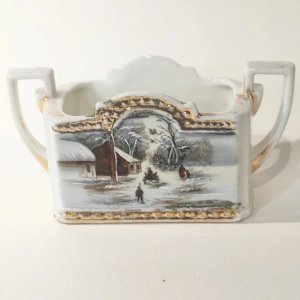 Antique porcelain pocket tray with snow landscape in the style of Currier & Ives.