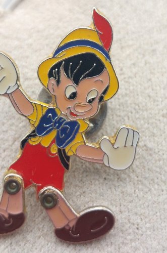 Ancien pin's / pins, Pinocchio, jambes articulées, Walt Disney Home Video