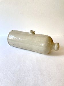 Antique horizontal earthenware hot water bottle, late 19th century.
