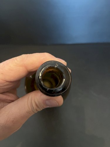 Ancienne bouteille en verre fumé ANGOT COULON DISTILATEUR MONTSUR MAYENNE