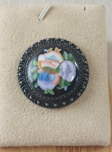 Ancienne broche, décor fleurs et argent