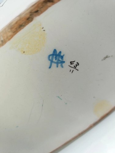 ancienne jardiniere en forme de panier à anse signée Geo Martel en bon etat