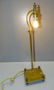 - ANCIENT BRASS LAMP WITH GLAND FEET, STATUE SUPPORT FOR HIGHLIGHTING D