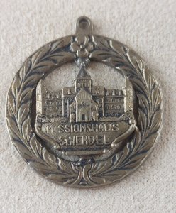Old religious medal, made of metal, Missionshaus St Wendel