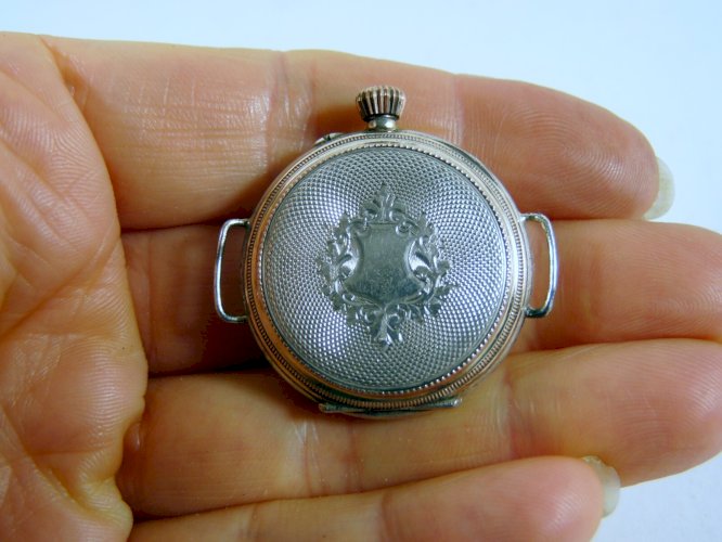 Ancienne montre à bracelet argent massif & or gravé & guilloché 10 rubis poinçon