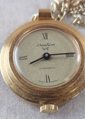 Ancienne montre gousset mécanique, Création WE, en métal doré, Germany