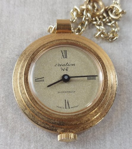 Ancienne montre gousset mécanique, Création WE, en métal doré, Germany