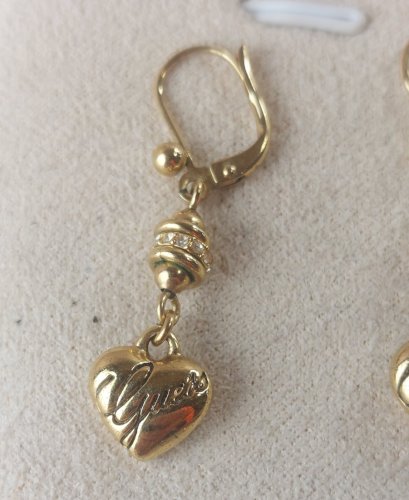 Ancienne paire de boucles doreilles pendantes, en métal doré, Guess