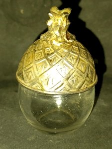 old silver-plated metal salt shaker in the shape of a pineapple in good condition