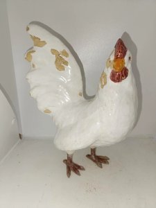 old ceramic chicken sculpture with metal foot in fair condition