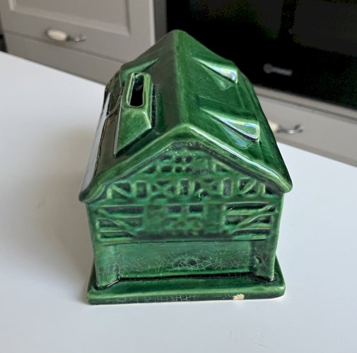 ancienne tirelire a casser en faience emaillee terre vernissee Saint Clement ?