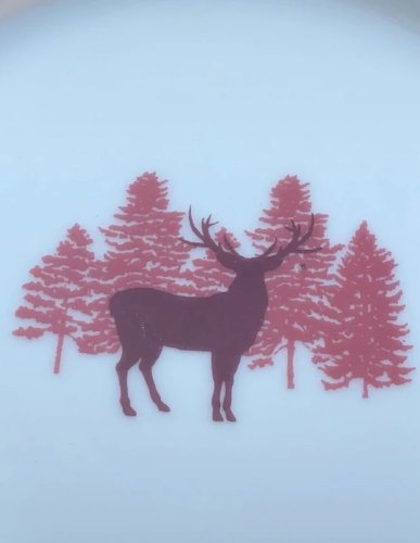 Assiette à dessert en porcelaine blanche et bordeaux au décor de Noël