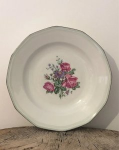 Retro vintage deep plate in porcelain with peony patterns.