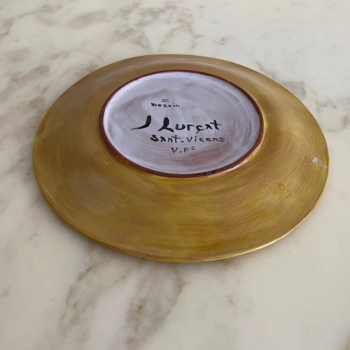 Assiette en terre cuite par Jean Lurçat décor de feuillage sur fond jaune M3760