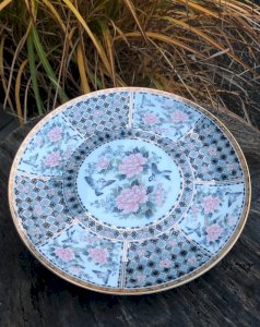 Vintage retro porcelain plate with flower and bird patterns