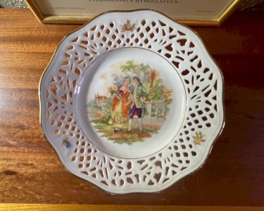 Vintage porcelain plate on a stand