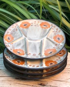 Vintage plates with orange flower patterns