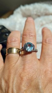 Ring with a blue topaz, diamonds, and amethysts in silver size 53