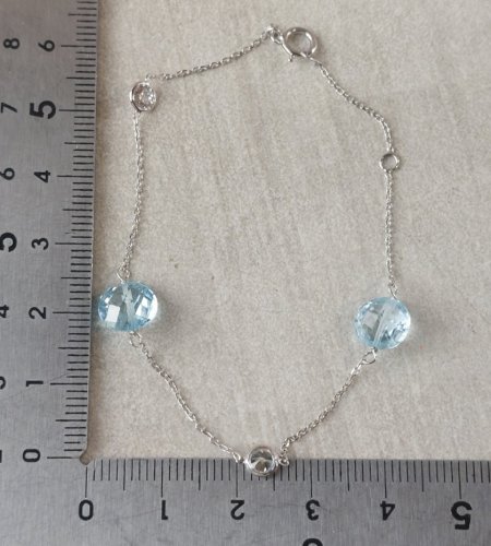 Beau bracelet en or blanc 375, topaze + zircon ^