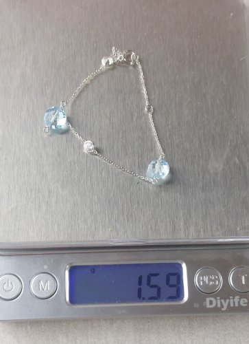 Beau bracelet en or blanc 375, topaze + zircon ^