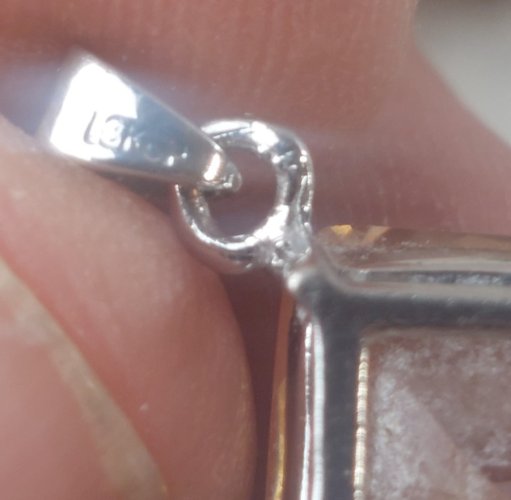 Beau pendentif strass orange, en métal argenté