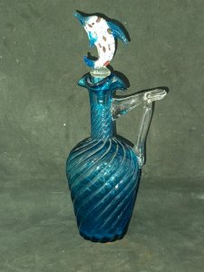 beautiful blue twisted glass pitcher/decanter with a dolphin-shaped stopper in good condition