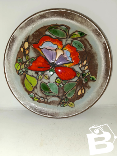 belle assiette emaillé à decor floral en bon etat