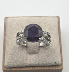 Beautiful ring with a purple stone and rhinestones, made of solid silver.