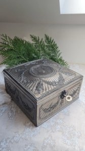Antique jewelry box (Spring) in repoussé silver-plated metal with tufted interior.