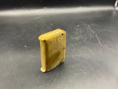 A matchbox shaped like a book.