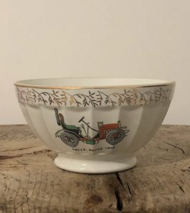 Retro vintage porcelain bowl with antique car pattern.