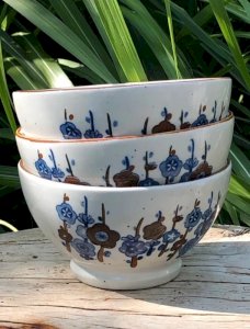 Vintage stoneware bowls with blue flower patterns
