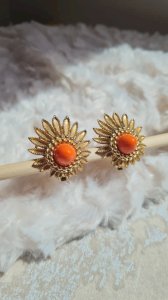 Gold and salmon metal clip earrings signed Marboux.