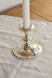 Antique silver-plated candle holder.