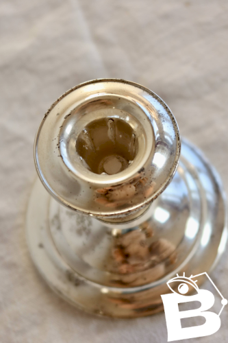 Bougeoir ancien en métal argenté patiné