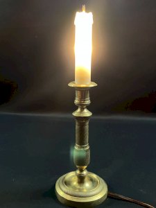 Bronze candle holder with guilloché decoration from the Restoration period mounted as a lamp.