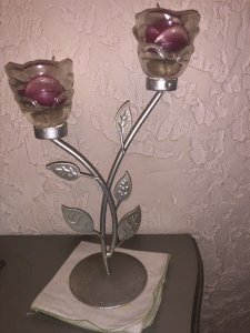 Candelabra shaped like roses with 2 candle branches included.