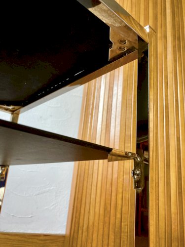 Bout de canapé en métal doré, dans le goût de la maison Jansen, années 1970