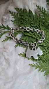 Bracelet with a silver metal dog
