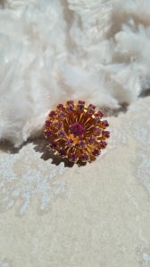 Antique brooch with fuchsia pink rhinestones.