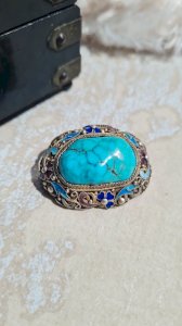 Ancient Chinese brooch in natural turquoise and silver enamel.
